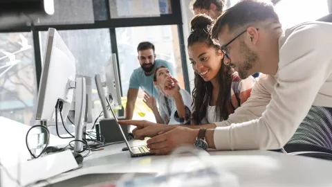 Young people working in front of computer